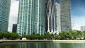 tilt footage of the rippling green water at Maurice A. Ferre Park and high ridge luxury condos and hotels and One Thousand Museum