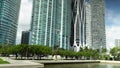 tilt footage of the rippling green water at Maurice A. Ferre Park and high ridge luxury condos and hotels and One Thousand Museum