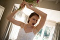 Tilt image of angry bride throwing bouquet at home Royalty Free Stock Photo