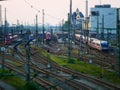 Tilt shift picture of trains leaving a railway station