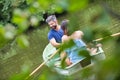 Tilt shot of happy mid adult couple boating in lake during summer