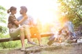 Tilt shot of romantic couple sitting at public park