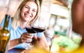 Tilted crop of happy couple toasting red wine at countryside restaurant - Food and beverage life style concept with boyfriend and Royalty Free Stock Photo