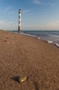 Tilted Kiipsaare lighthouse from beach surface view