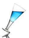 Tilted Wine Glass With Blue Drink on White Background