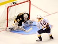 Tim Thomas makes save against Martin Erat. Royalty Free Stock Photo