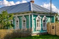 Timashovo, Russia - August 2018: Old village log house with beautiful carved platbands