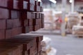 Timber Flooring Factory. Pile of cut wood in factory storage warehouse. Lumber in warehouse Royalty Free Stock Photo