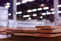 Timber Flooring Factory. Pile of cut wood in factory storage warehouse. Lumber in warehouse Royalty Free Stock Photo