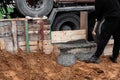 Timber formwork with metal reinforcement for pouring concrete and creating a solid foundation for a building or fence.