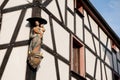 Timber framing house with religious statue Royalty Free Stock Photo