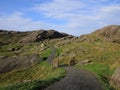 Timber gate, farmland an rock formations in Rogaland Royalty Free Stock Photo