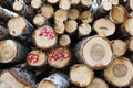 Timber: A pile of logs or firewood with annual growth rings and spray paint markings showing Royalty Free Stock Photo