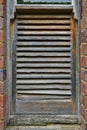 Timber slatted window as part of a nold stable in Victorian countryside.