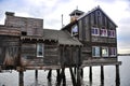 Timber stilt house sits over water at Seaport Village in San Diego, California Royalty Free Stock Photo