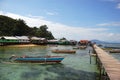 Timber town pier with jukung boats Indonesia Royalty Free Stock Photo