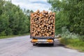 Timber truck with a forest rides on the highway with cargo Royalty Free Stock Photo