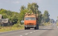 Timber truck with a forest rides on the highway with cargo Royalty Free Stock Photo