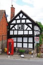 Timbered building and red phone box, Pembridge. Royalty Free Stock Photo