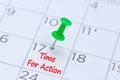 Time For Action written on a calendar with a green push pin to r