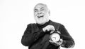 Time and age concept. Bearded man clock ticking. Aged man holding alarm clock. Lifetime ageing and getting older. Senior