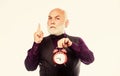 time and age. Timekeeping. mature man with beard clock show time. time management. business startup. retirement