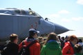 People near the Russian fighter-interceptor MiG-31BM RF-95448 with the airborne number 37 red on a sunny day. Close-up
