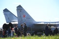People near the tail of the Russian fighter-interceptor MiG-31BM RF-95448