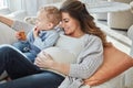 This time around, Ill be an expert mom. a pregnant woman bonding with her toddler son at home. Royalty Free Stock Photo