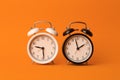 Time background concept. Vintage classic alarm clock on orange empty background. Time management concept Royalty Free Stock Photo