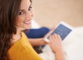 Time catch up with some friends. a gorgeous young woman using a digital tablet indoors. Royalty Free Stock Photo