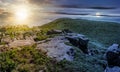 Time change concept with huge boulders on the edge of hillside Royalty Free Stock Photo