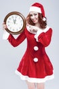 Time and Christmas Holiday Concept and Ideas. Gleeful Red-Haired Santa Helper With Big Round Clock Royalty Free Stock Photo