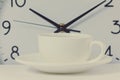 Time for a coffee break, work with coffee cup and clock at ten o clock isolated on white Royalty Free Stock Photo