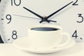 Time for a coffee break, work with coffee cup and clock at ten o clock on white Royalty Free Stock Photo