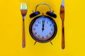 Time concept of dieting. Black alarm clock Royalty Free Stock Photo