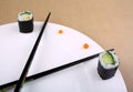 Time Concept of sushi on white plate Royalty Free Stock Photo