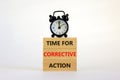 Time for corrective action symbol. Wooden blocks with words `Time for corrective action` on a beautiful white background. Black Royalty Free Stock Photo