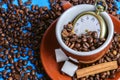 It is time for Cup of coffee with beans from above on blue background with cinnamon and sugar Royalty Free Stock Photo