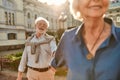 Time doesn`t matter love is forever. Beautiful and happy elderly couple holding hands and smiling while spending time