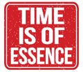 TIME IS OF ESSENCE, text written on red stamp sign