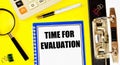 Time for evaluation. A text label in the planning notebook. Royalty Free Stock Photo