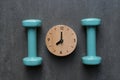 Time for exercising clock and dumbbell Royalty Free Stock Photo