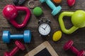 Time for exercising clock and fitness equipment Royalty Free Stock Photo