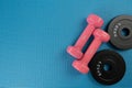 Time for exercising sport equipment on the blue yoga mat background, healthy and workout concept Royalty Free Stock Photo