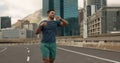 Time, fitness and a man running in the city for sports training, getting ready for a marathon or race. Watch, exercise