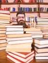 Time flow concept. Teacher or student with beard studying in library. Man on serious face watching time is going over Royalty Free Stock Photo