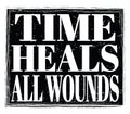 TIME HEALS ALL WOUNDS, text on black stamp sign