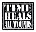 TIME HEALS ALL WOUNDS, text written on black stamp sign