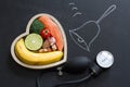 Time for health heart abstract diet food concept on blackboard with bell Royalty Free Stock Photo